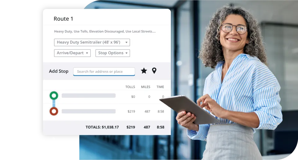 Woman with a tablet beside a Trimble Transportation route panel showing toll and mileage totals