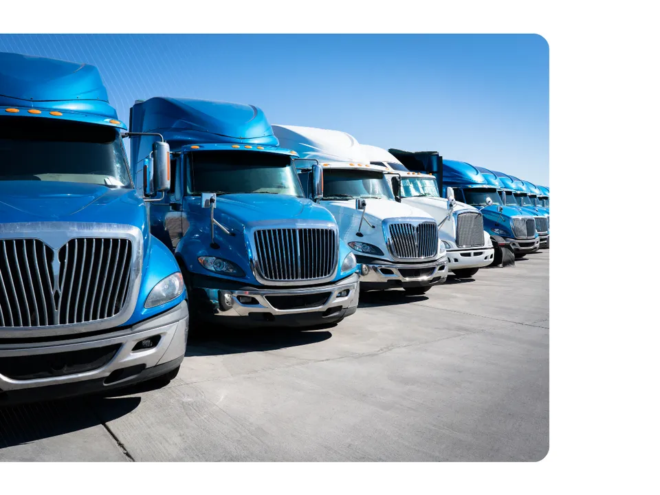 Fleet of trucks parked at terminal for freight procurement and carrier network planning