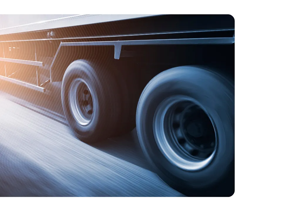 Truck wheels in motion representing freight execution and transportation sourcing performance