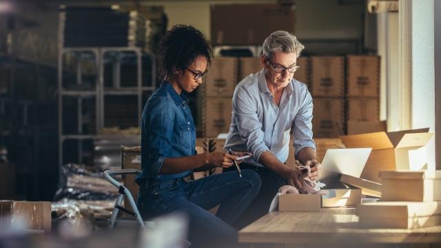 Two women working in a warehouse