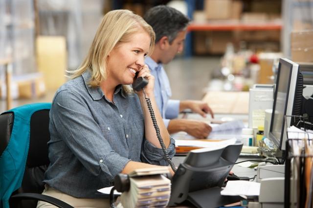 Woman talking on the phone in an office