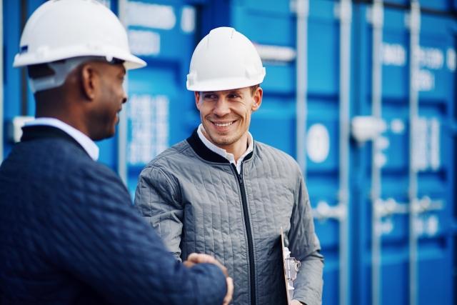 Partnership of shippers and carriers in front of cargo