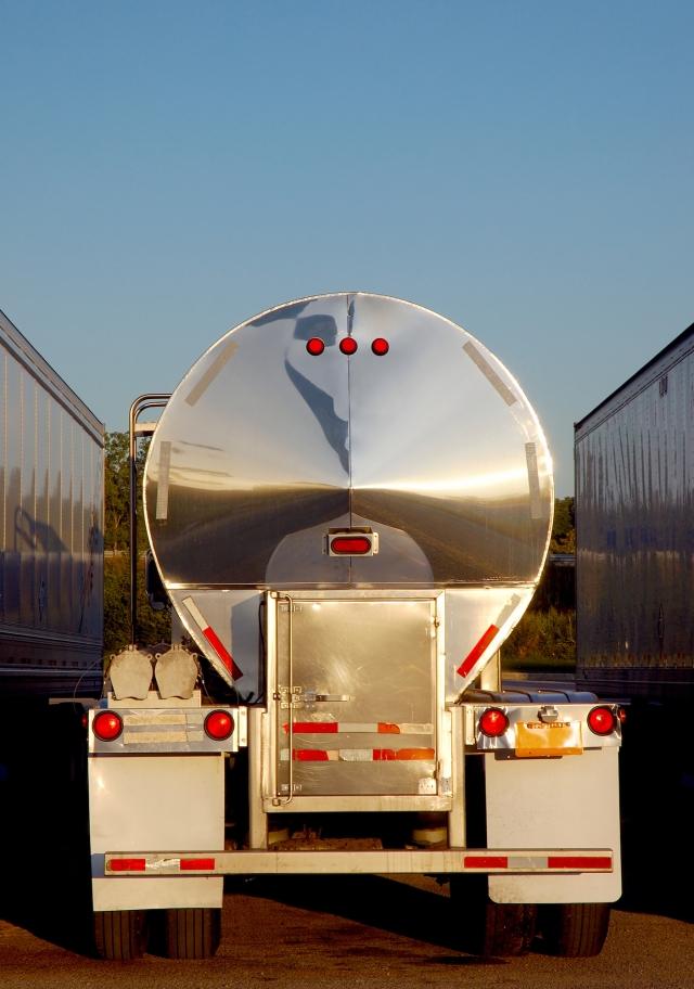The rear end of a semi in a parking lot