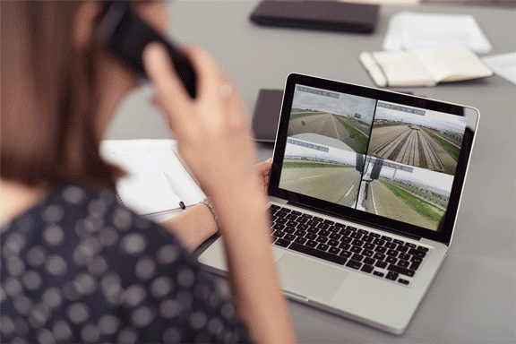 woman in dispatch office watching video intelligence footage