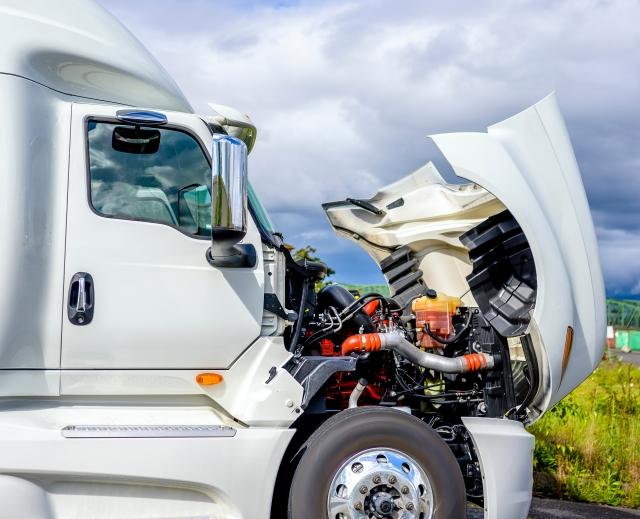 Truck broken down with hood up