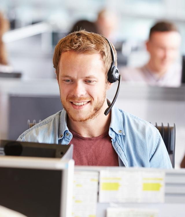 broker on headset in dispatch office