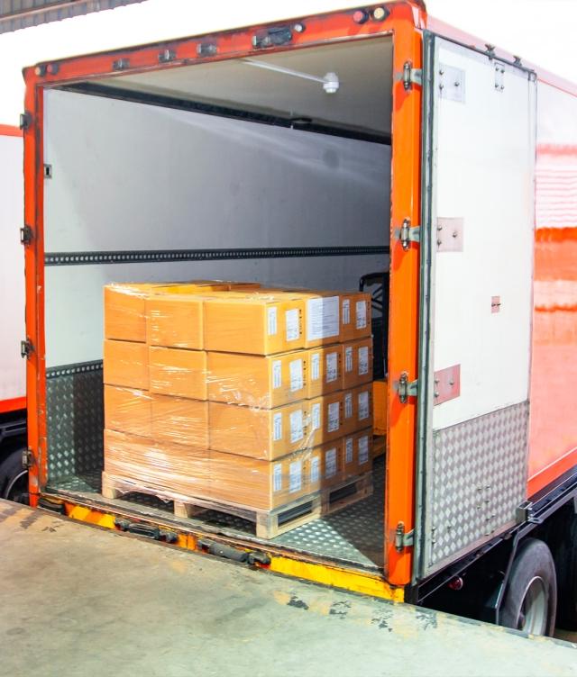 Pallets of freight on the back of an open truck