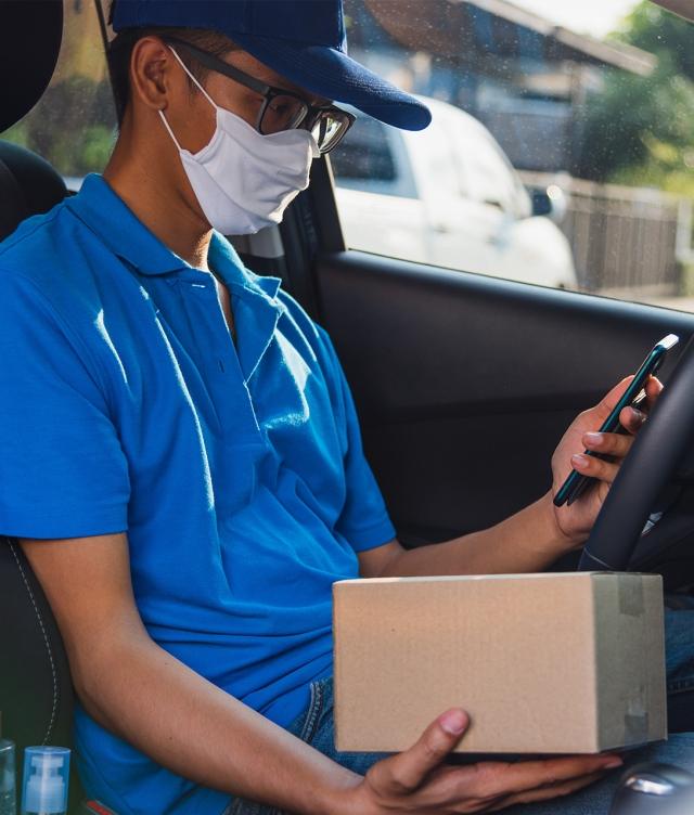 delivery driver looking at phone