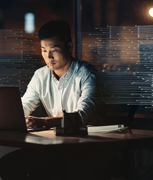 Man in dark using Trimble Dispatch Advisor
