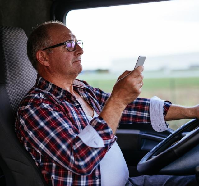 driver with phone in front seat