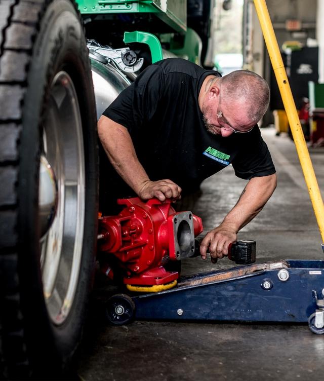 heniff mechanic repairing truck