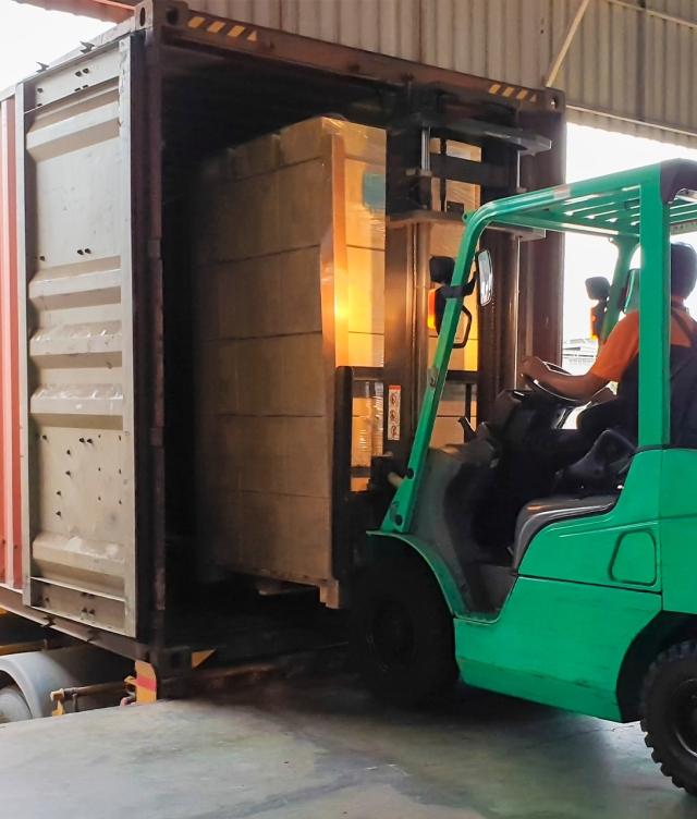 forklift loading freight into truck