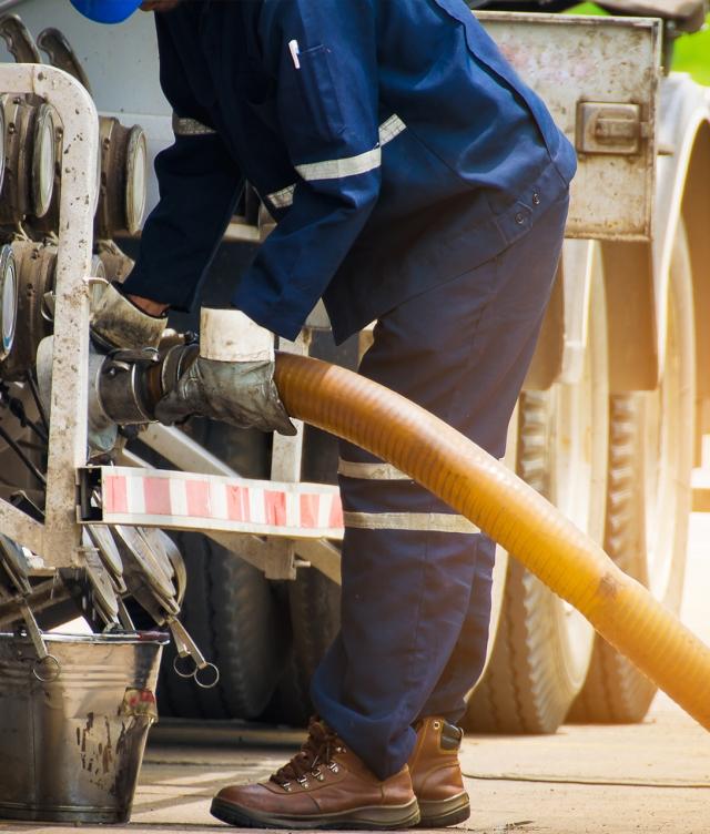 Man Fueling Truck Unloading Fuel