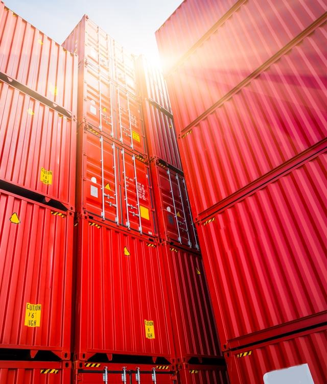 stacked red cargo containers