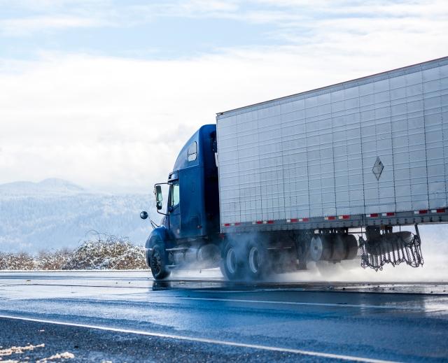 side view of truck on road
