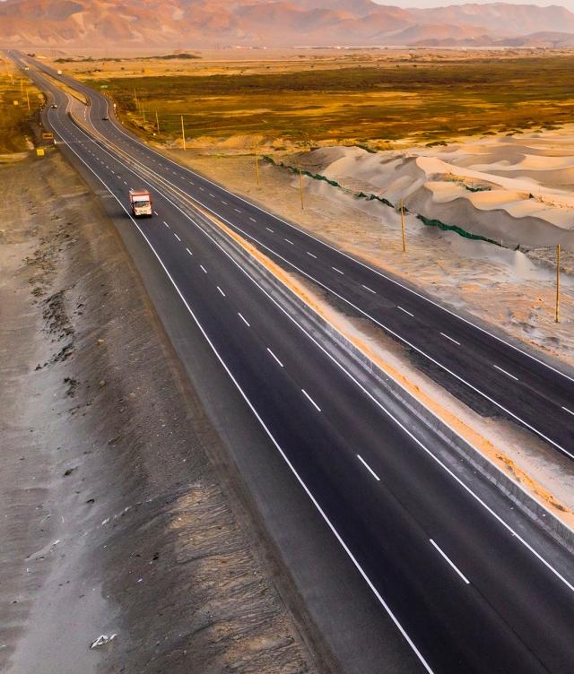 Lone truck on dessert road carried cargo