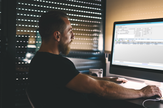 man in office on computer