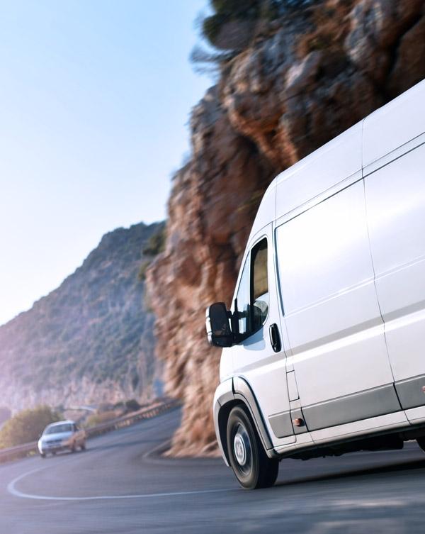 Sprinter van driving on road