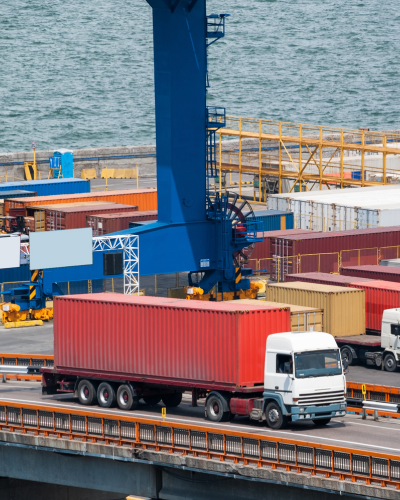Intermodal freight shipping container transported by multiple modes of transportation